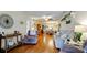 Spacious living room featuring wood floors, ceiling fan, and comfortable seating at 4133 Heron Way # E202, Bradenton, FL 34205