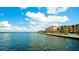Scenic waterfront view of the bridge, the bay, a walkway and apartments at 4133 Heron Way # E202, Bradenton, FL 34205
