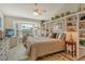 Well-lit bedroom featuring built-in shelving and a large window with a view at 4149 Salernes Ave # 3048, Sarasota, FL 34233