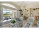 Open living area featuring comfortable seating, light-colored walls, and sliding glass doors to the outdoor patio at 4149 Salernes Ave # 3048, Sarasota, FL 34233