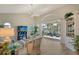 Inviting living room with neutral tones, a large window, and views of the outdoor patio and serene waterfront at 4149 Salernes Ave # 3048, Sarasota, FL 34233