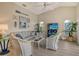 Cozy living room with vaulted ceilings, comfortable seating, and nautical decor, creating a relaxing atmosphere at 4149 Salernes Ave # 3048, Sarasota, FL 34233
