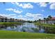 Scenic view of the pond with a fountain, enhancing the natural beauty of the community at 4149 Salernes Ave # 3048, Sarasota, FL 34233