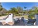 Cozy balcony view featuring outdoor seating and a serene view of the verdant lawn and mature trees at 44 Tidy Island Blvd, Bradenton, FL 34210