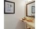 A modern bathroom features a marble countertop and beautiful glass sink at 44 Tidy Island Blvd, Bradenton, FL 34210