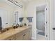 A clean bathroom features modern vanity lighting and a glass door shower at 44 Tidy Island Blvd, Bradenton, FL 34210