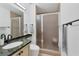 A stylish bathroom features granite countertops and a glass door shower at 44 Tidy Island Blvd, Bradenton, FL 34210
