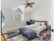 A naturally lit bedroom features a vaulted ceiling, ceiling fan, and workspace at 44 Tidy Island Blvd, Bradenton, FL 34210