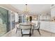 Cozy breakfast nook features a chandelier, table with seating and a great view to the water at 44 Tidy Island Blvd, Bradenton, FL 34210