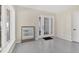 Bright entryway with views, speckled floors, and glass paned doors provide access to the exterior of the property at 44 Tidy Island Blvd, Bradenton, FL 34210