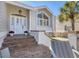 Inviting home entrance features a decorative door and well-manicured landscaping at 44 Tidy Island Blvd, Bradenton, FL 34210