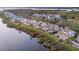 Stunning waterfront homes offer balconies and patios overlooking the peaceful water and green landscape at 44 Tidy Island Blvd, Bradenton, FL 34210