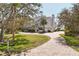 Beautiful home with a brick driveway, manicured landscaping, and classic architectural details at 44 Tidy Island Blvd, Bradenton, FL 34210