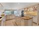 Bright kitchen with granite counters, island with cooktop, double oven and views of the water at 44 Tidy Island Blvd, Bradenton, FL 34210