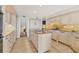 Well-appointed kitchen features an island with cooktop, granite countertops, and a suite of stainless steel appliances at 44 Tidy Island Blvd, Bradenton, FL 34210