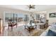 Open living room showing water views, stylish furnishings, and access to a lovely outdoor space at 44 Tidy Island Blvd, Bradenton, FL 34210