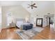 Bright bedroom featuring a vaulted ceiling, hardwood floors, and stylish furnishings at 44 Tidy Island Blvd, Bradenton, FL 34210
