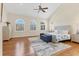 Spacious main bedroom with tray ceilings, hardwood floors, and three large windows for natural light at 44 Tidy Island Blvd, Bradenton, FL 34210