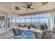Enjoy the covered patio with great views of the water, chairs, and a table to sit and appreciate the scenery at 44 Tidy Island Blvd, Bradenton, FL 34210