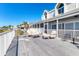 Spacious and covered patio offers a relaxing outdoor living space to enjoy coastal breezes and scenic views at 44 Tidy Island Blvd, Bradenton, FL 34210