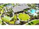 Beautiful aerial view of community amenities including pool, fire pit, and recreation areas at 4617 Alexandria Ct, Palmetto, FL 34221