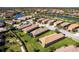 Scenic aerial shot of a home nearby a peaceful lake with beautifully landscaped areas, situated in a secure, gated community at 4617 Alexandria Ct, Palmetto, FL 34221