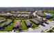 Breathtaking aerial view of a home, showcasing a serene lake and beautifully landscaped surroundings in a gated community at 4617 Alexandria Ct, Palmetto, FL 34221