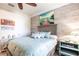 Comfortable bedroom showcasing stylish furniture, light blue walls, and a ceiling fan at 4617 Alexandria Ct, Palmetto, FL 34221