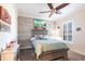 Comfortable bedroom showcasing stylish furniture, light blue walls, and a ceiling fan at 4617 Alexandria Ct, Palmetto, FL 34221