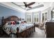 Charming bedroom featuring a cozy rocking chair, bright natural light, and beautiful decor at 4617 Alexandria Ct, Palmetto, FL 34221