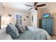 Relaxing bedroom featuring stylish décor, a ceiling fan, and bright lighting at 4617 Alexandria Ct, Palmetto, FL 34221