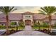 Community Clubhouse featuring lush landscaping and upscale architectural details at 4617 Alexandria Ct, Palmetto, FL 34221