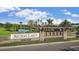 Community sign for Artisan Lakes with lush landscaping and water features in the background at 4617 Alexandria Ct, Palmetto, FL 34221