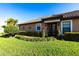 Attractive home featuring a well-kept lawn and decorative shrubs enhancing the property's entrance at 4617 Alexandria Ct, Palmetto, FL 34221