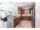 Well-equipped kitchen featuring granite countertops, stainless steel appliances, and wooden cabinets at 4617 Alexandria Ct, Palmetto, FL 34221