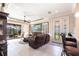 Cozy living room featuring tiled floors, neutral wall colors and a double glass door to the outside at 4617 Alexandria Ct, Palmetto, FL 34221