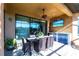 Relaxing screened patio with stylish furniture, outdoor kitchen, and beautiful views at 4617 Alexandria Ct, Palmetto, FL 34221