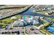 Aerial view of the community clubhouse, pool, parking, bocce ball and basketball courts at 4856 Coastal Days Ln, Bradenton, FL 34211
