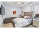 Bedroom features a sitting area, large window, and contemporary decor at 4856 Coastal Days Ln, Bradenton, FL 34211