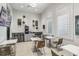 Relaxing common area with tables, chairs, coffee machine, and stylish decor and ample windows at 4856 Coastal Days Ln, Bradenton, FL 34211