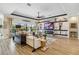 Bright living room showcasing modern decor, a sleek fireplace, and a view of the outdoor pool at 4856 Coastal Days Ln, Bradenton, FL 34211