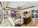 Open living area with decorative shelving, contemporary furnishings, and access to other living spaces at 4856 Coastal Days Ln, Bradenton, FL 34211
