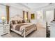 Spacious main bedroom with decorative lamps, neutral paint and a tray ceiling at 4856 Coastal Days Ln, Bradenton, FL 34211