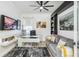 Stylish home office features built-in shelving, neutral decor and ample workspace at 4856 Coastal Days Ln, Bradenton, FL 34211