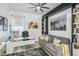 Comfortable home office with a sleek desk, comfortable seating and modern accents at 4856 Coastal Days Ln, Bradenton, FL 34211