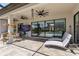 Outdoor patio space with a tv, seating, and access to the pool area at 4856 Coastal Days Ln, Bradenton, FL 34211