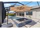 Backyard pool with a jacuzzi, shaded lounge area, and spacious patio at 4856 Coastal Days Ln, Bradenton, FL 34211
