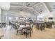 Restaurant dining area features tables, chairs, full bar and televisions for patrons' enjoyment at 4856 Coastal Days Ln, Bradenton, FL 34211