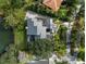 Overhead aerial view of a luxurious property with pool, patio, and meticulous landscaping at 49 Osprey Point Dr, Osprey, FL 34229