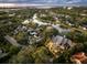 Aerial view of a luxury home, neighborhood, and waterfront at 49 Osprey Point Dr, Osprey, FL 34229